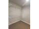 Walk-in closet with wire shelving at 2439 Muirfield Pl, Atlanta, GA 30337