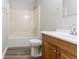 Bathroom featuring a tub and a wooden vanity at 310 Rippling Brook Trce, Palmetto, GA 30268