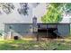 Exterior of home with deck overlooking spacious backyard at 310 Rippling Brook Trce, Palmetto, GA 30268