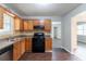 Kitchen featuring wooden cabinets and appliances at 310 Rippling Brook Trce, Palmetto, GA 30268