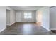 Spacious room with light-grey walls and modern vinyl floors at 310 Rippling Brook Trce, Palmetto, GA 30268