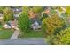 Stunning aerial view of home with lush landscaping, mature trees, and welcoming curb appeal at 4186 Stillwater Pt, Ellenwood, GA 30294