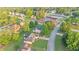 An aerial view shows the neighborhood with its well-maintained lawns, mature trees, and winding roads, suggesting a peaceful community at 4186 Stillwater Pt, Ellenwood, GA 30294