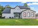 Expansive backyard features well-maintained lawn, mature trees, and a beautiful home exterior at 4186 Stillwater Pt, Ellenwood, GA 30294