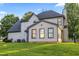 Lush backyard features mature trees, manicured lawn, and lovely exterior views of the home at 4186 Stillwater Pt, Ellenwood, GA 30294