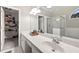 Bright bathroom with a walk-in closet, a large vanity, and a glass-enclosed shower at 4186 Stillwater Pt, Ellenwood, GA 30294
