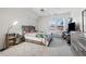 Cozy bedroom features carpeted floor, large window, and comfortable sleeping space at 4186 Stillwater Pt, Ellenwood, GA 30294