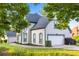 Charming home with manicured lawn, beautiful trees, and attached garage, creating great curb appeal at 4186 Stillwater Pt, Ellenwood, GA 30294