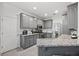 Modern kitchen with gray cabinetry, granite countertops, and stainless steel appliances, perfect for cooking at 4186 Stillwater Pt, Ellenwood, GA 30294