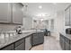 Updated kitchen with stainless steel appliances, granite countertops, and ample cabinet space at 4186 Stillwater Pt, Ellenwood, GA 30294