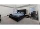 Spacious main bedroom with a plush bed, carpet flooring, and ample natural light at 4186 Stillwater Pt, Ellenwood, GA 30294