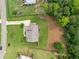 An aerial view shows a beautiful landscaped yard with mature trees and a well-maintained home at 107 Equest Dr, Canton, GA 30115