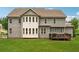 Picturesque backyard of the home, features a deck, large windows and well-maintained lawn at 107 Equest Dr, Canton, GA 30115