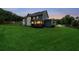 The backyard has a spacious lawn and a wooden deck that is perfect for outdoor entertaining at 107 Equest Dr, Canton, GA 30115