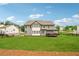 Expansive backyard with large lawn, deck and fence provides ample space for outdoor activities at 107 Equest Dr, Canton, GA 30115