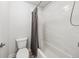 Cozy bathroom with shower and tub combination, white subway tile, and gray vanity at 107 Equest Dr, Canton, GA 30115