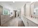 This bathroom boasts dual sinks, white cabinets, and a separate glass shower and soaking tub at 107 Equest Dr, Canton, GA 30115