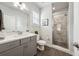 Modern bathroom features gray vanity with white countertop and glass enclosed shower with decorative tile surround at 107 Equest Dr, Canton, GA 30115