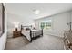 Bedroom with a full bed, carpet, two bedside tables, and a window at 107 Equest Dr, Canton, GA 30115