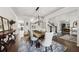 Elegant dining room with hardwood floors, stylish lighting, and open layout at 107 Equest Dr, Canton, GA 30115