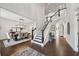 Elegant foyer with hardwood floors, staircase, and a view into the dining area at 107 Equest Dr, Canton, GA 30115