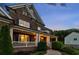 The house features a welcoming front porch with classic columns and manicured landscaping at 107 Equest Dr, Canton, GA 30115