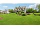Well-maintained front yard with lush green grass and mature landscaping around a beautiful house at 107 Equest Dr, Canton, GA 30115