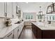 Modern kitchen with long countertop and an island with pendant lighting at 107 Equest Dr, Canton, GA 30115