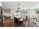Spacious kitchen with marble counters, large island, pendant lighting, stainless steel appliances, and eat-in dining area at 107 Equest Dr, Canton, GA 30115