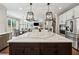 Kitchen island overlooks living area, with stainless steel appliances and modern finishes at 107 Equest Dr, Canton, GA 30115