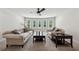 Spacious living room featuring neutral carpeting, a ceiling fan, and two comfortable sofas at 107 Equest Dr, Canton, GA 30115