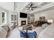 Bright living room features coffered ceiling, fireplace, and comfortable seating at 107 Equest Dr, Canton, GA 30115