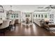 Open layout showing kitchen, breakfast nook, and living room with hardwood flooring at 107 Equest Dr, Canton, GA 30115
