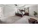 Spacious main bedroom with a decorative tray ceiling, a ceiling fan, and plush carpeting at 107 Equest Dr, Canton, GA 30115