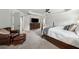 Main bedroom with large carpeted floors, wood furniture, tray ceiling, and reading chair at 107 Equest Dr, Canton, GA 30115