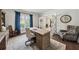 Cozy home office with a comfortable chair, desk, and a window with natural light at 107 Equest Dr, Canton, GA 30115