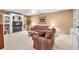 Finished basement featuring built-in shelves, comfortable seating, and recessed lighting at 1564 Stepstone Way, Lawrenceville, GA 30043