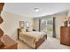 Comfortable bedroom with natural lighting and traditional furniture, creating a warm and inviting atmosphere at 1564 Stepstone Way, Lawrenceville, GA 30043