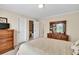Spacious bedroom featuring wooden furniture and large windows, filled with natural light at 1564 Stepstone Way, Lawrenceville, GA 30043