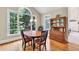 Bright breakfast nook with large windows and hardwood floors, perfect for morning meals at 1564 Stepstone Way, Lawrenceville, GA 30043