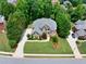 Aerial view of a beautiful brick two-story home with a well-manicured lawn and driveway at 1564 Stepstone Way, Lawrenceville, GA 30043