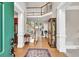 Elegant foyer showcasing hardwood floors, a staircase, and high ceilings that create a grand and welcoming entrance at 1564 Stepstone Way, Lawrenceville, GA 30043