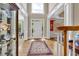 Bright and spacious foyer with hardwood floors, tall ceilings, and a view of the front door and adjacent living spaces at 1564 Stepstone Way, Lawrenceville, GA 30043