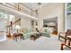 Bright and open living room features high ceilings, large windows, and a view to the kitchen at 1564 Stepstone Way, Lawrenceville, GA 30043