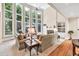Beautiful living room with tall windows, built-in shelves, and a cozy fireplace at 1564 Stepstone Way, Lawrenceville, GA 30043