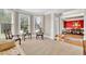 Comfortable living room with neutral carpet, large windows, and an open doorway to a formal dining area at 1564 Stepstone Way, Lawrenceville, GA 30043