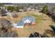 An aerial view of the home with the three-car garage, and the deck at 1650 Old Loganville Rd, Loganville, GA 30052