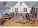 Spacious back deck with a fire pit and seating area for outdoor entertaining at 1650 Old Loganville Rd, Loganville, GA 30052