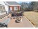 The backyard features a deck, seating, a firepit, and lush green space at 1650 Old Loganville Rd, Loganville, GA 30052
