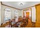 Traditional dining room featuring hardwood floors, light-filled windows, and classic wood trim at 1650 Old Loganville Rd, Loganville, GA 30052